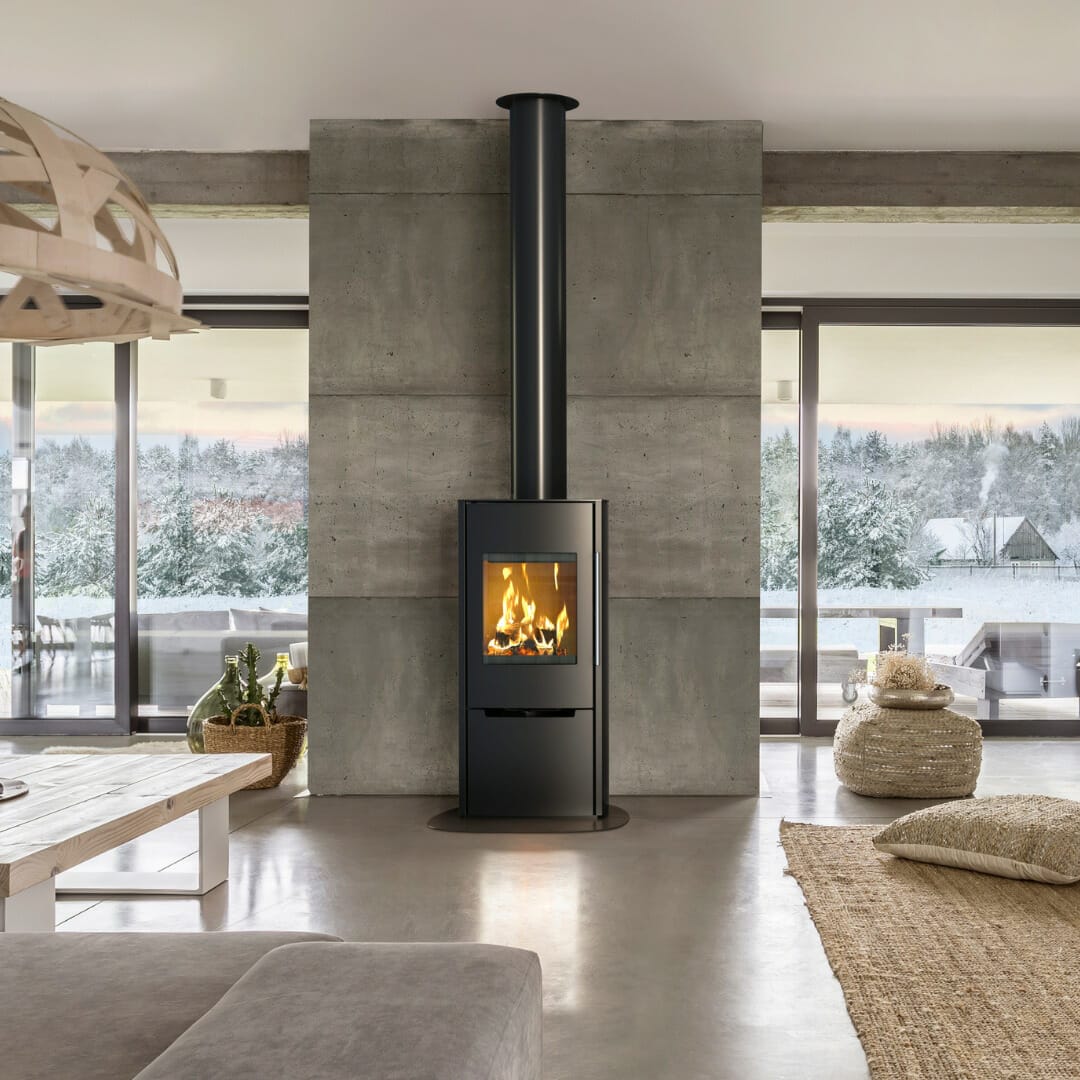 Modern freestanding stove with concrete surround